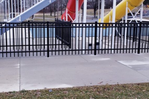 Photo of a fence surrounding a pool