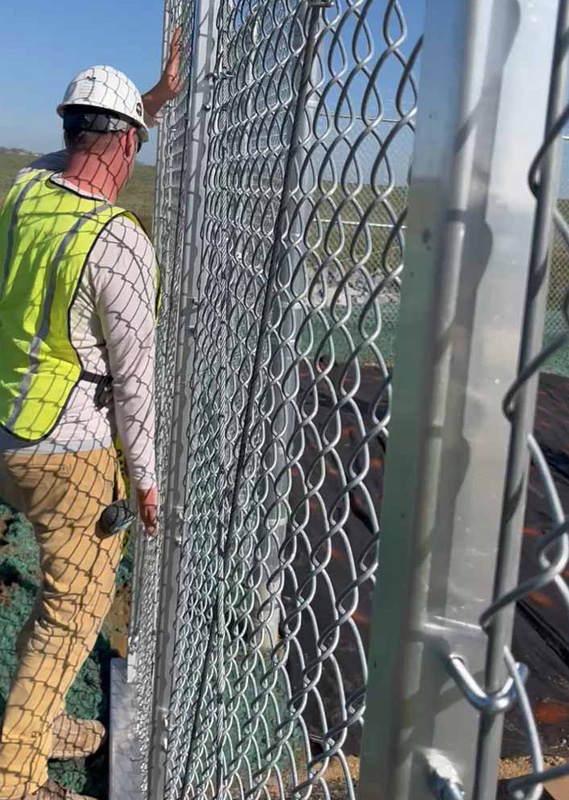 Photo of a Pro max Employee installing a fence