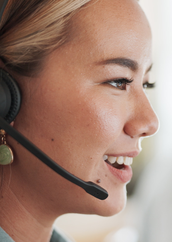 Photo of a woman with a phone head set